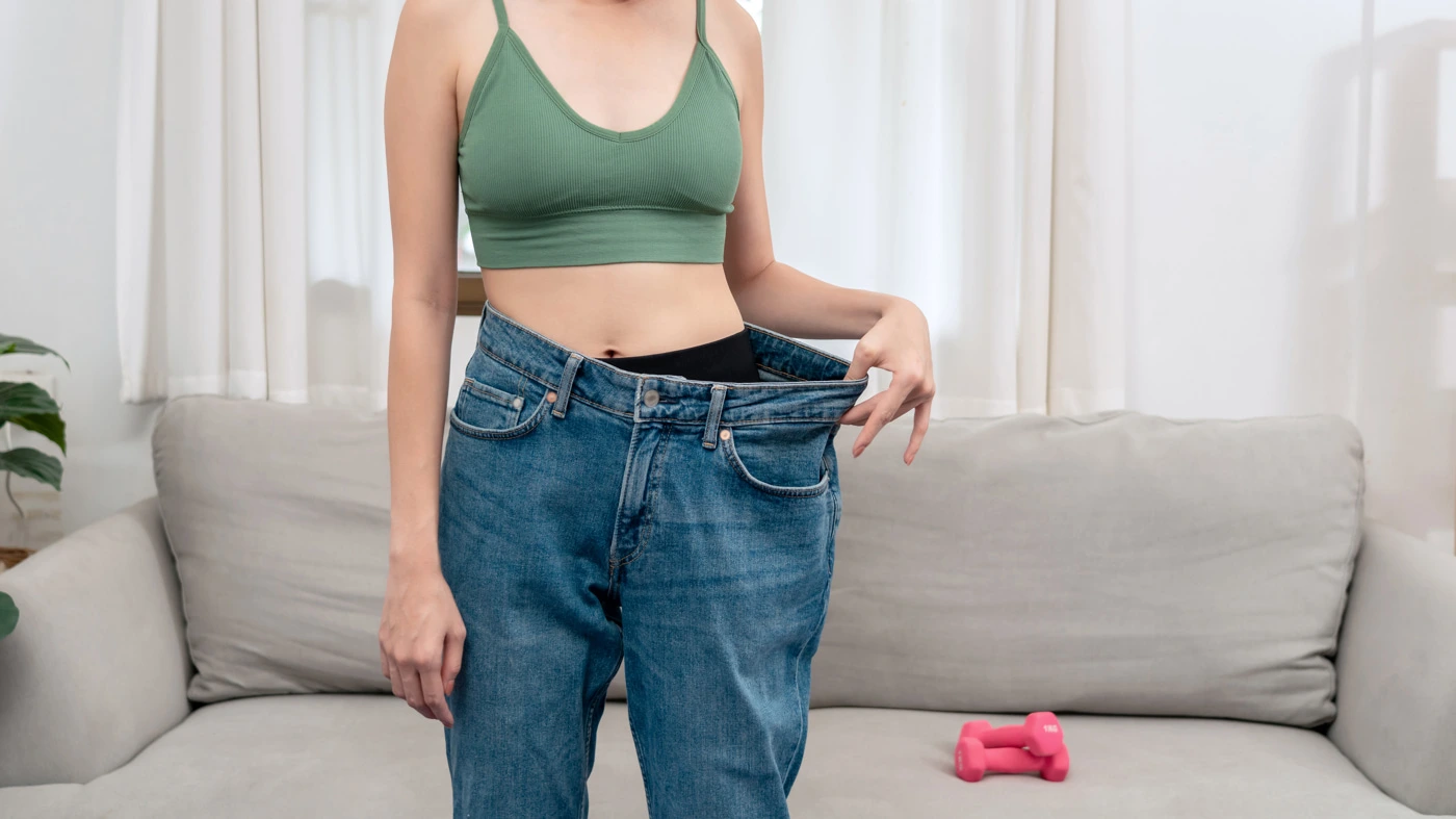 sporty-woman-is-smiling-while-wearing-in-loose-big-2024-10-12-20-35-08-opti
